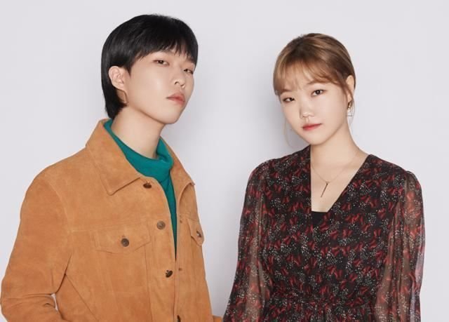 AKMU, "AKMU Lee Chanhyuk and Lee Suhyun profile photo 2026" "AKMU members Lee Chanhyuk and Lee Suhyun" "AKMU Flowering album cover 2026" "AKMU Lee Chanhyuk solo profile" "AKMU Lee Suhyun solo profile" "AKMU K-pop Star 2 winners" "AKMU 2026 comeback promotion" "AKMU Fountain of Inspiration agency" "AKMU Paradise of Rumors music video" "AKMU sibling duo concert performance"